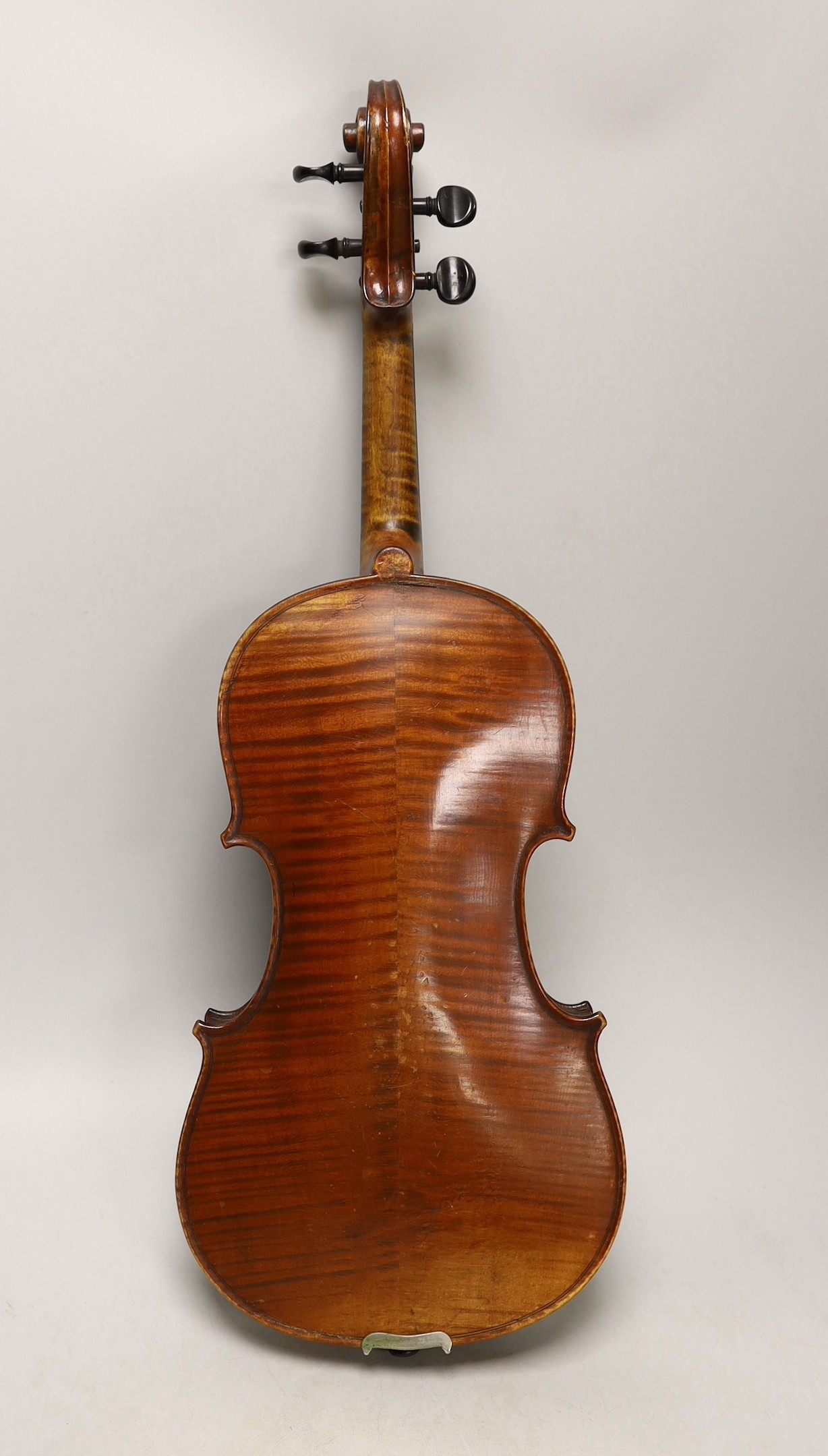 A cased French double backed violin, interior label reads ‘Copie de J.B. Vuillaume à Paris.’ Back measures 36cm excluding button